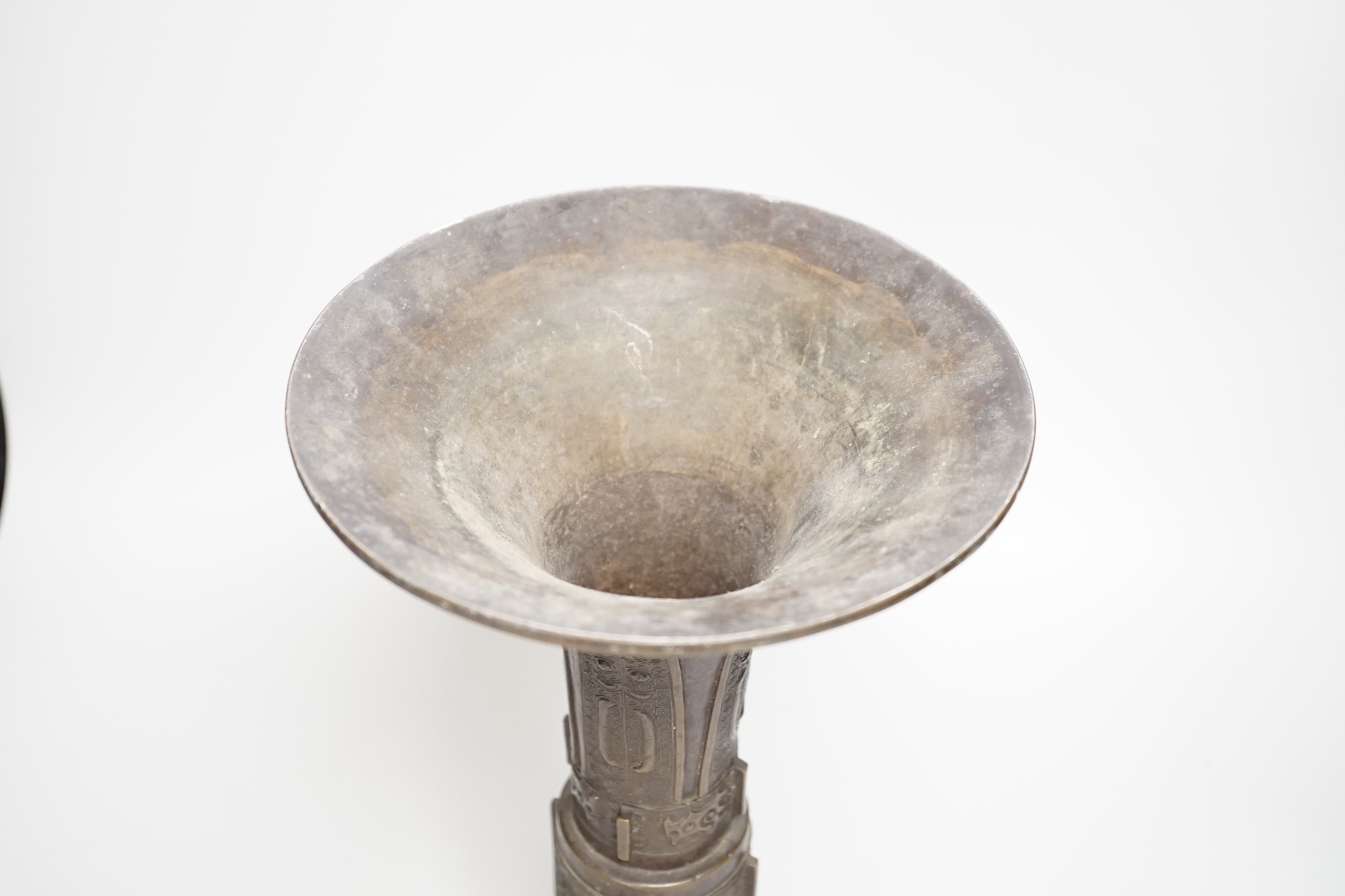 An 18th/19th century Chinese archaistic bronze beaker vase, gu, 34cm high